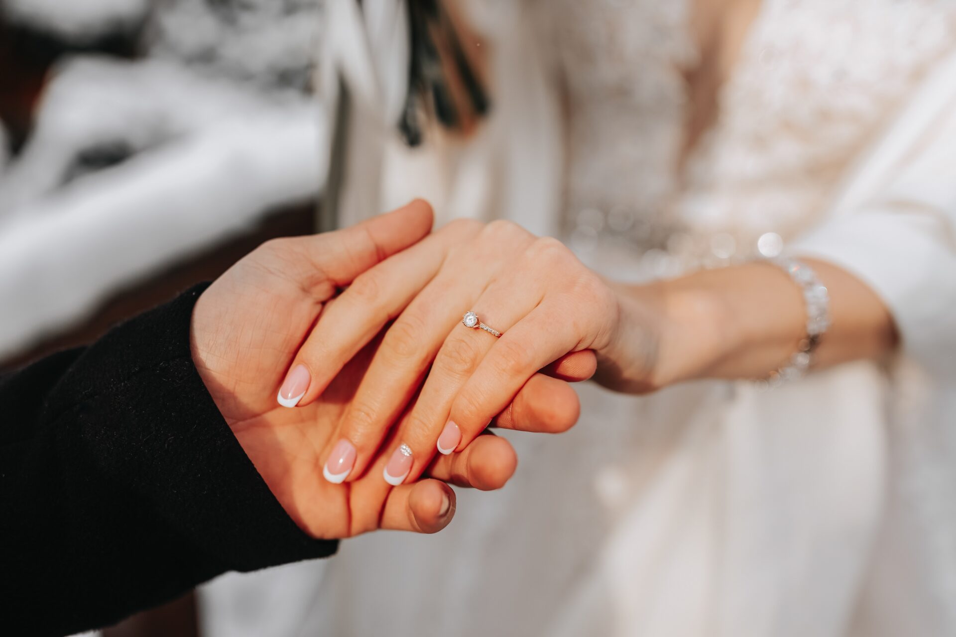 gold diamond ring on finger